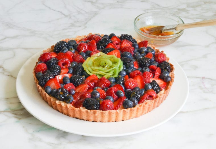 Colorful French fruit tart on a plate.