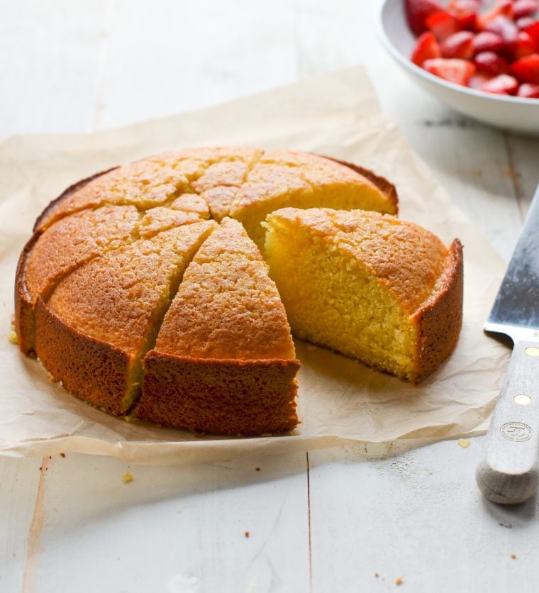 Sliced olive oil cake missing a piece.