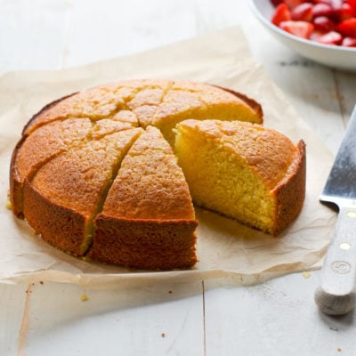 Sliced olive oil cake missing a piece.