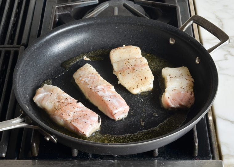 pan-searing halibut on first side