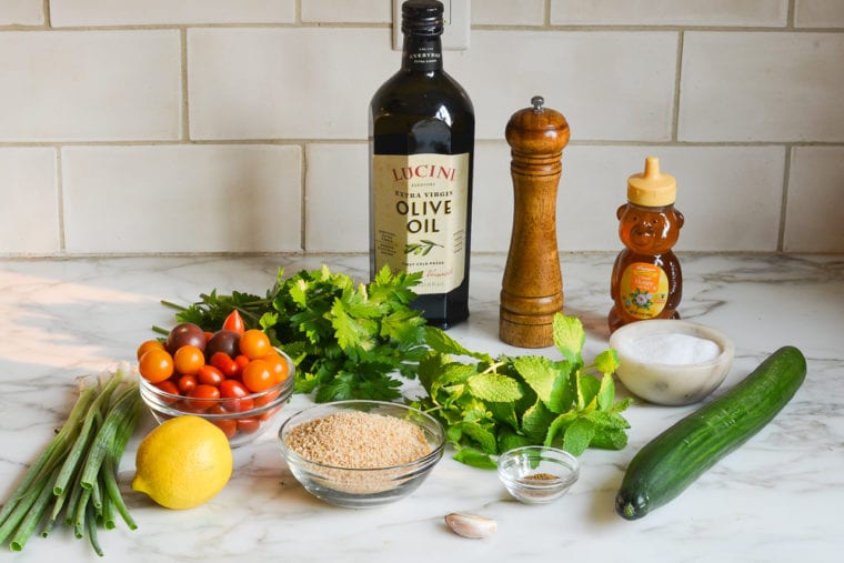 Tabbouleh ingredients including honey, olive oil, and lemon.