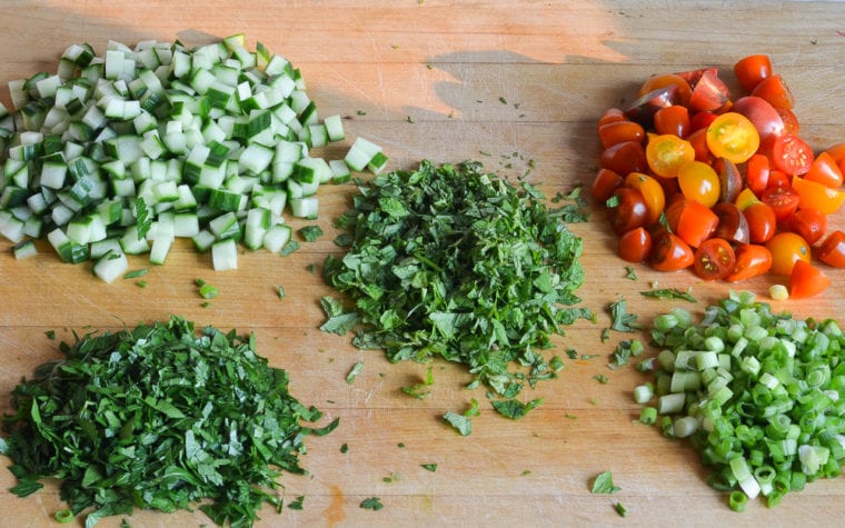 chopped herbs and vegetables for tabbouleh