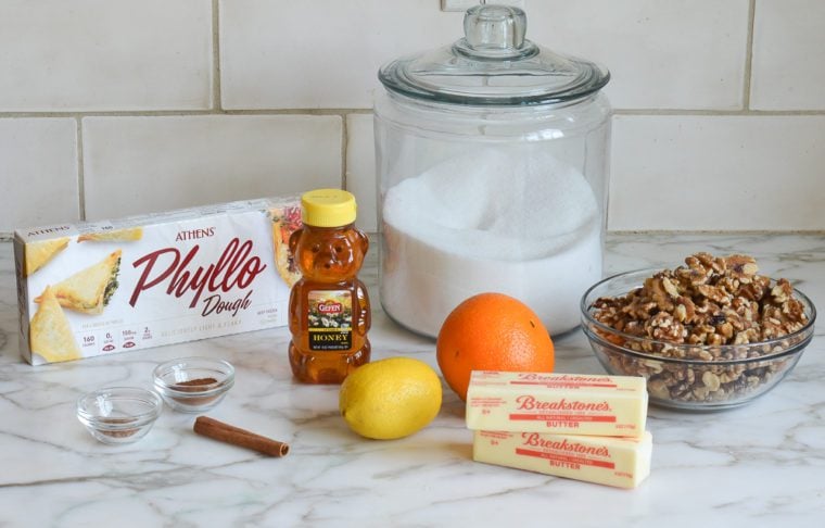 Baklava ingredients including phyllo dough, honey, and butter.