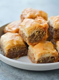 Baklava piled on a plate.