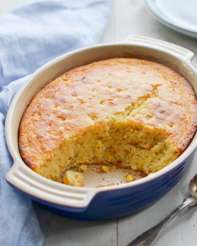 Partially-served dish of spoon bread.