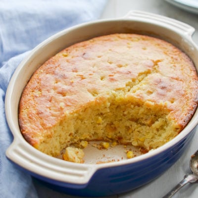 Partially-served dish of spoon bread.