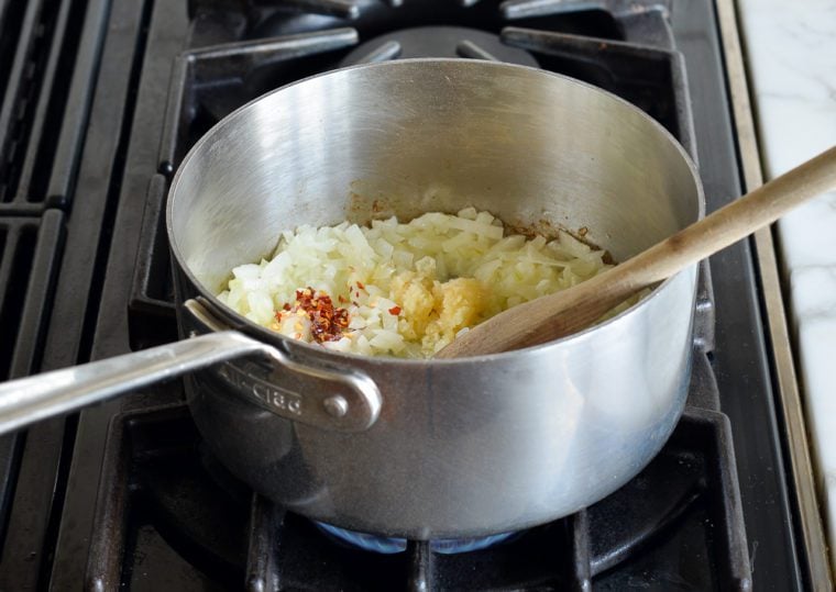 adding garlic and red pepper flakes