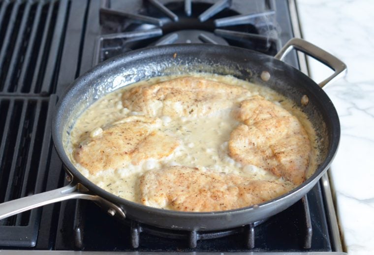 chicken finishing cooking in simmering sauce