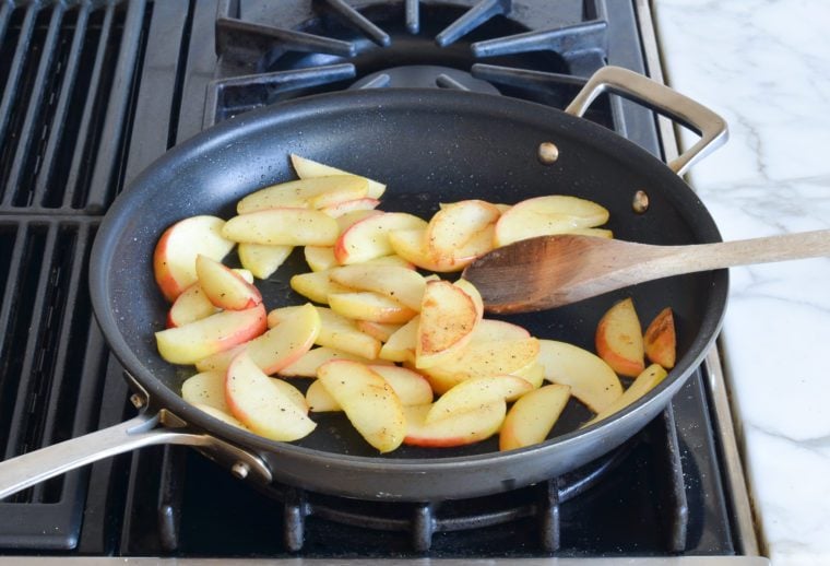 lightly browned apples in skillet