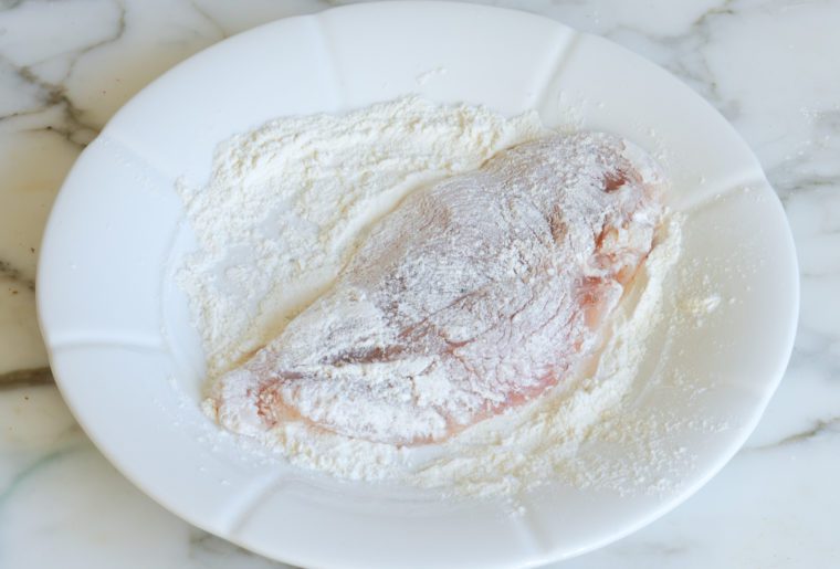 dredging chicken in flour