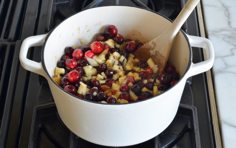 stirring chutney ingredients in pot