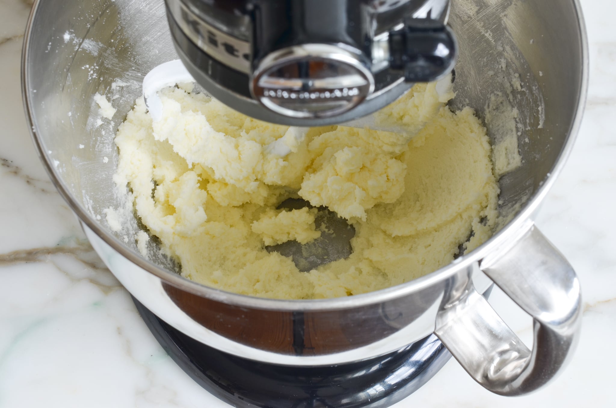 Butter and sugar after beating in a mixing bowl.