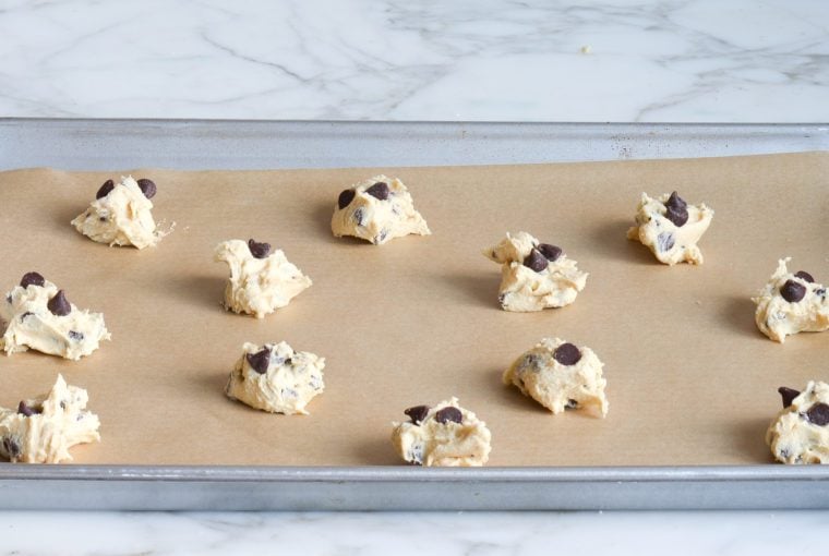 cookie dough balls on baking sheet