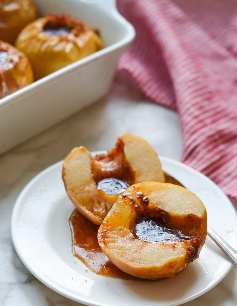 Baked apples on a small plate.