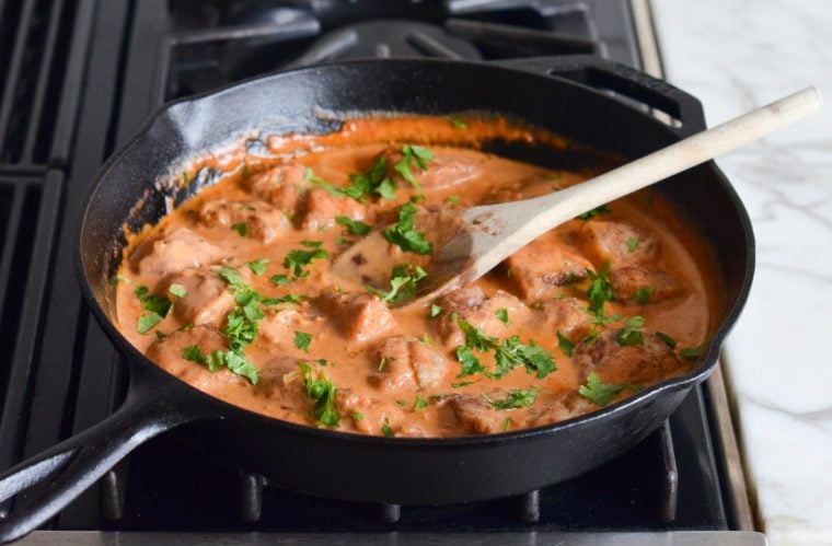 adding cilantro to butter chicken
