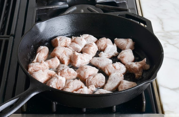 browning chicken on first side in skillet