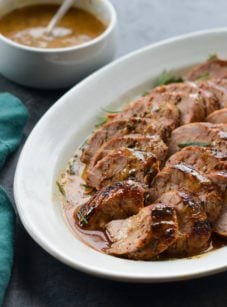 Serving tray of mustard-glazed pork tenderloin.
