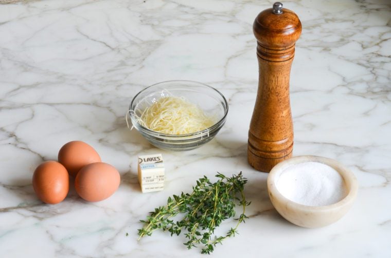 Omelette ingredients including eggs, butter, and salt.