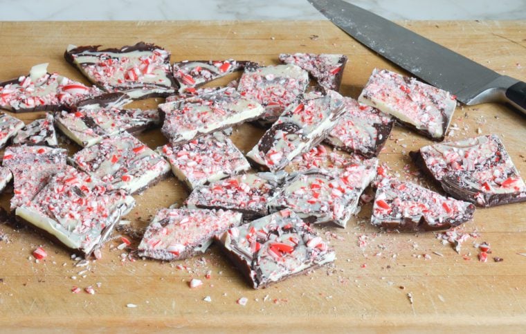 cut peppermint bark on cutting board