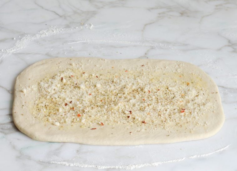 layering oil, garlic, oregano and pecorino Romano