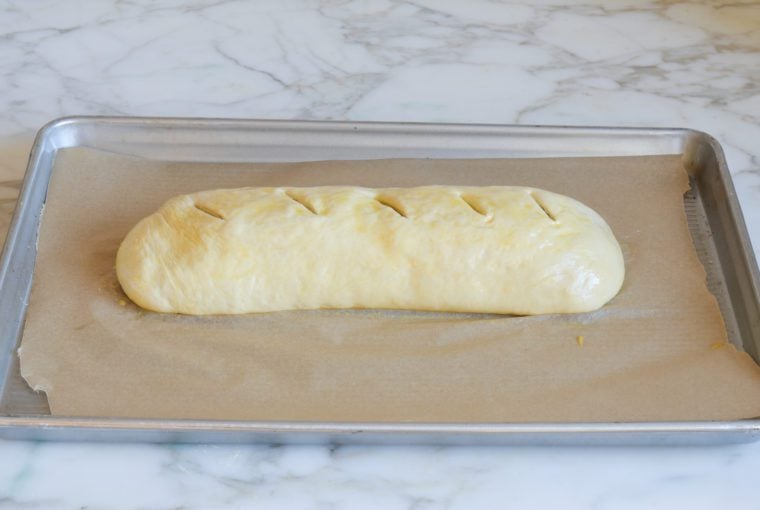 brushing stromboli with egg wash