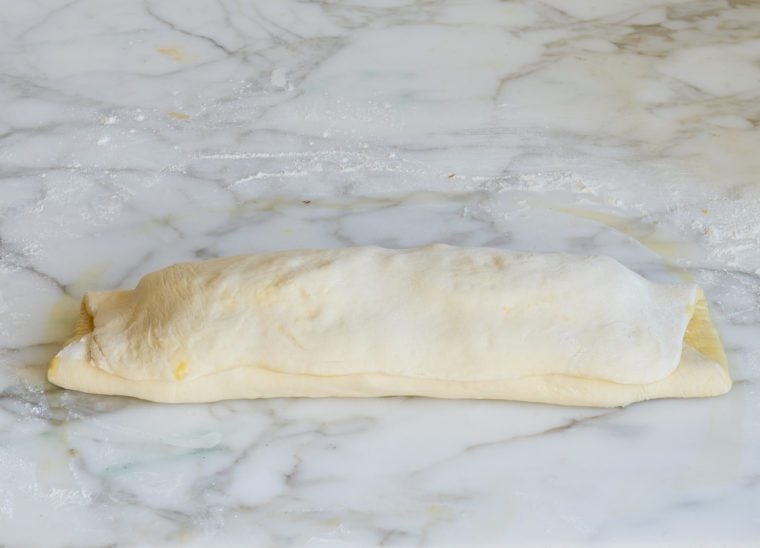 Rolled stromboli on a countertop.
