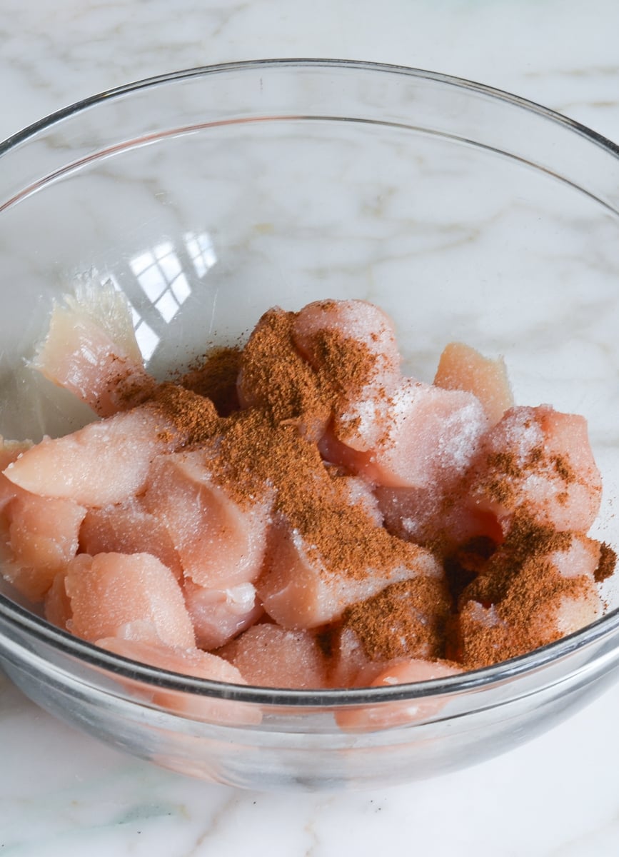 chicken in bowl with spices