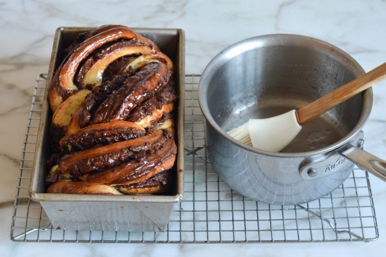 brushing glaze on baked babka