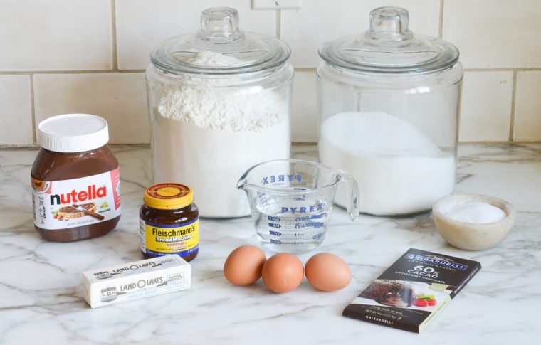 Babka ingredients including yeast, eggs, and Nutella.
