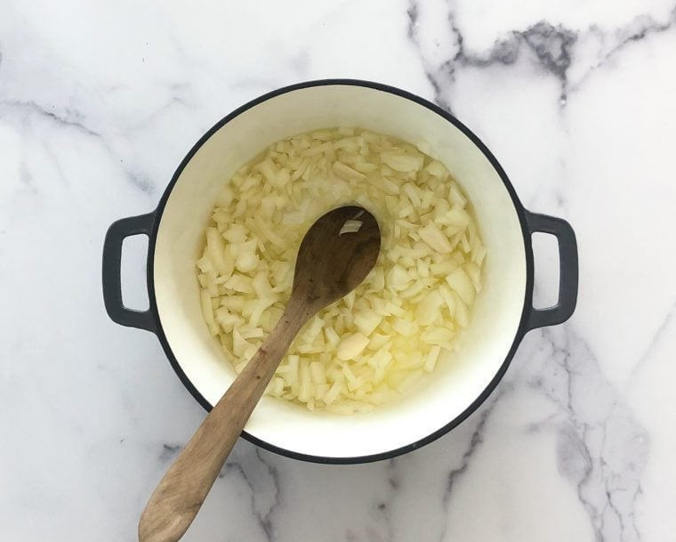 adding onions and garlic to the butter