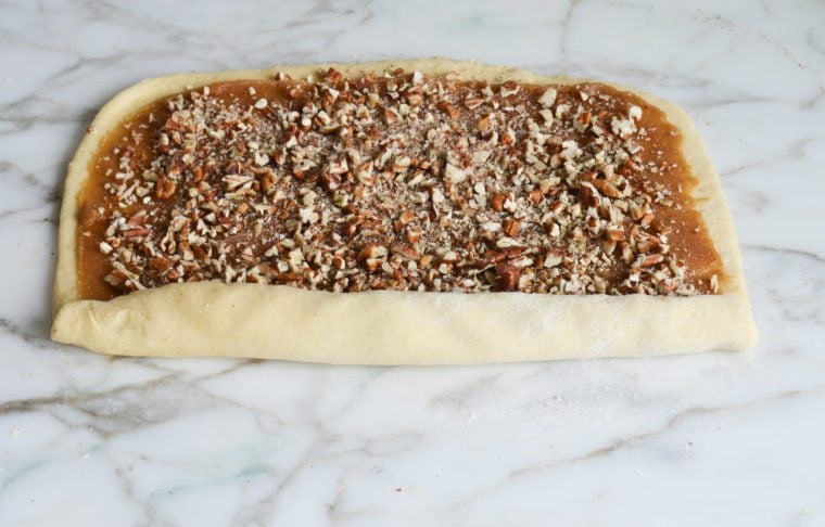 rolling the dough into a log