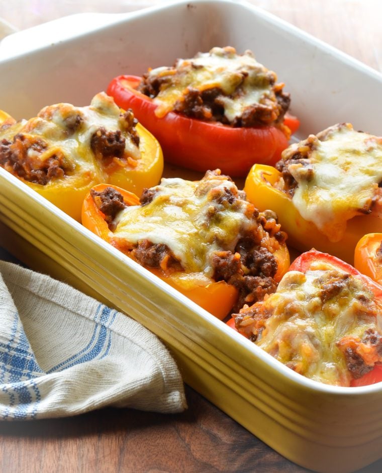 Stuffed peppers in a baking dish.
