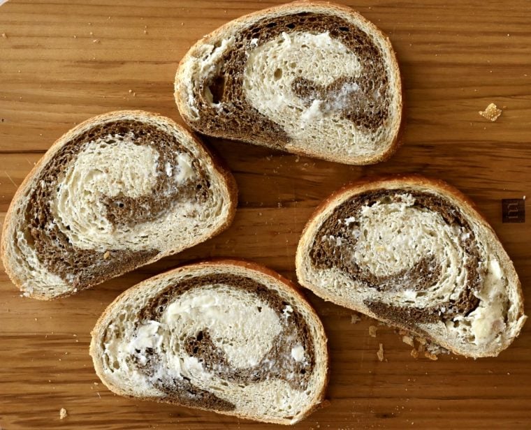 Buttered bread on cutting board