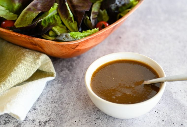 Spoon in a bowl of balsamic vinaigrette.