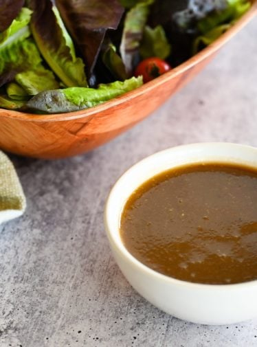 Spoon in a bowl of balsamic vinaigrette.