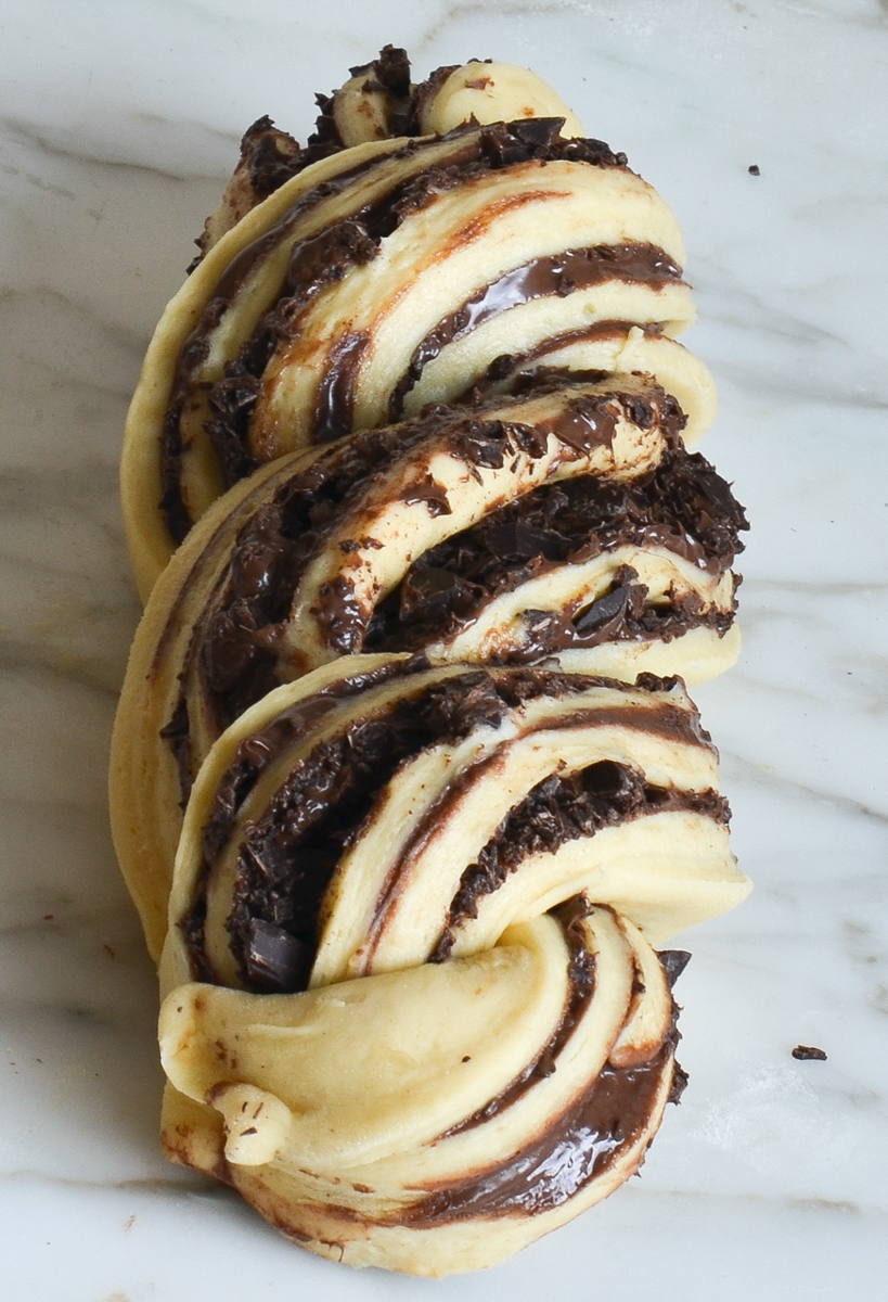 twisted babka dough on marble.