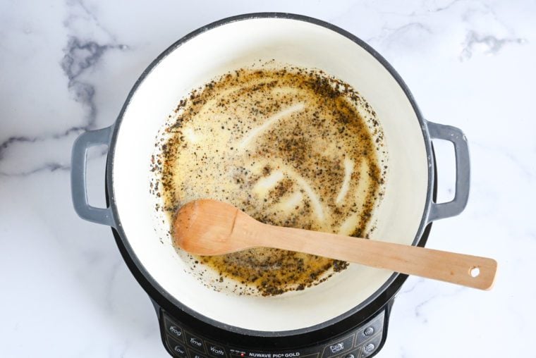 stirring butter and pepper
