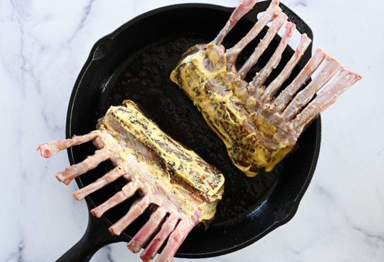 racks of lamb coated with Dijon mustard