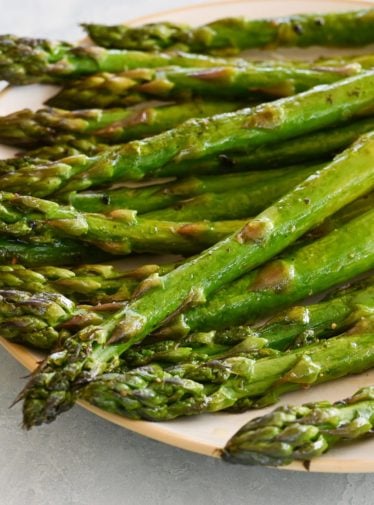 Roasted asparagus on a plate.