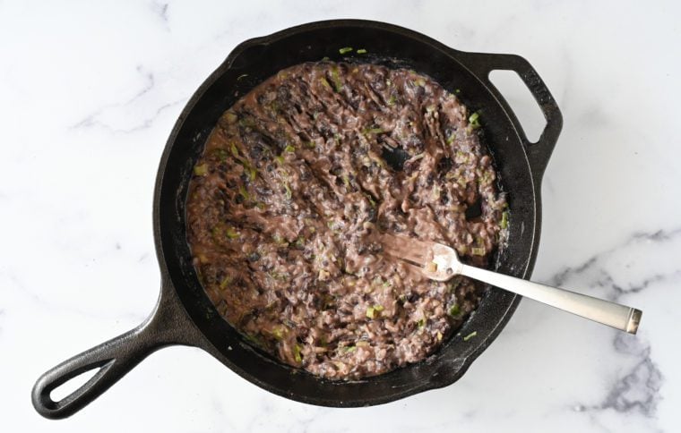 mashed black bean mixture in skillet