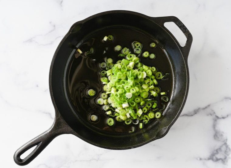 adding scallions to oil