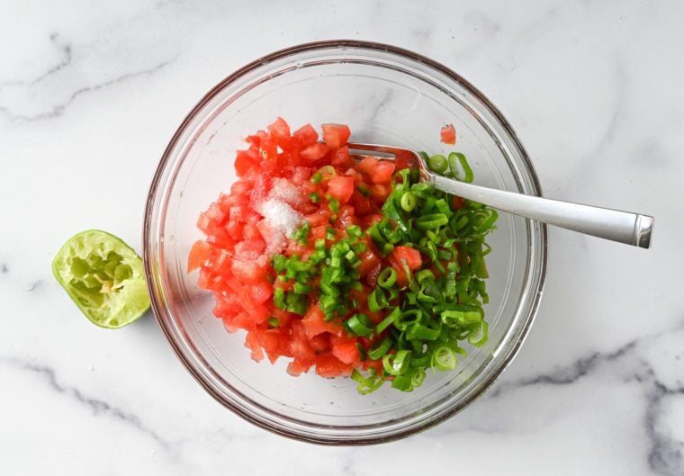 salsa ingredients in mixing bowl