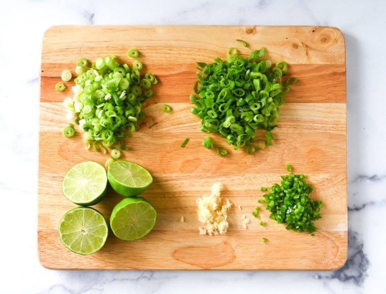 scallions, garlic, jalapeno, and lime prep for 7 layer dip