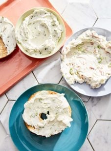Schmear on plates and bagels.