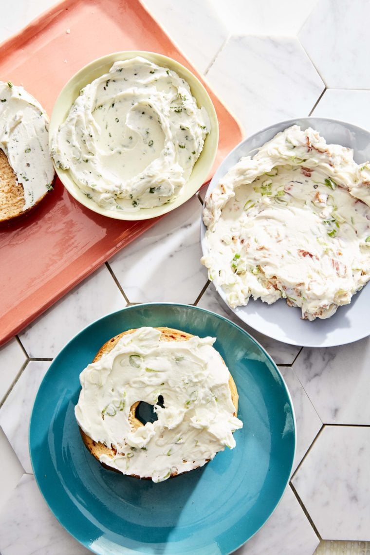 Schmear on plates and bagels.