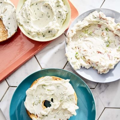 Schmear on plates and bagels.