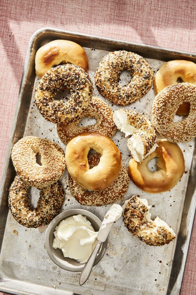 Lined baking sheet of Montreal bagels.