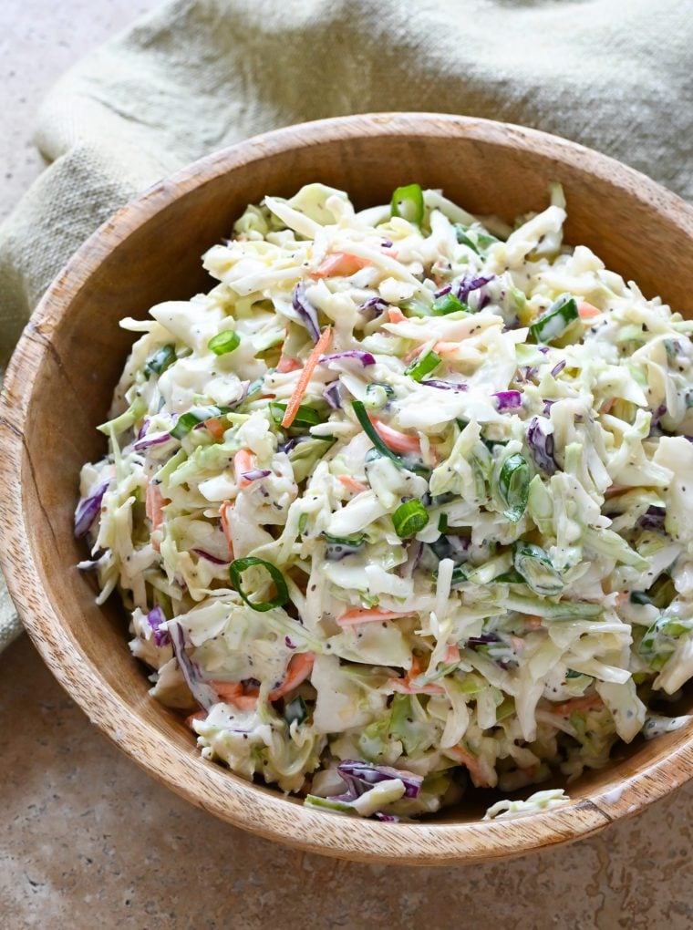 Wooden bowl of coleslaw.