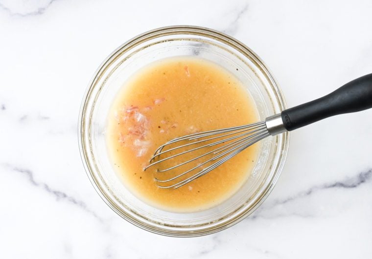adding the shallots to the vinaigrette