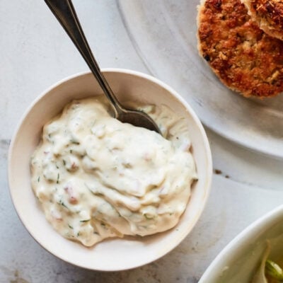 Spoon in a bowl of tartar sauce.